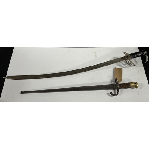 104 - 19th Century French chassepot bayonet with original steel scabbard and a 20th century Indian cavalry... 