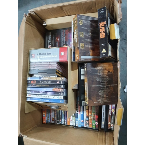 110 - Box of DVDs & Cassettes including box sets - John Wayne at War, 6 million dollar man, the first seri... 