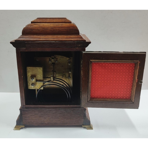 152 - W&H, Fine quality Oak cased clock with glazed front, with key and pendulum