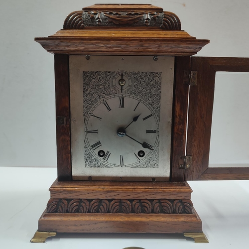 152 - W&H, Fine quality Oak cased clock with glazed front, with key and pendulum