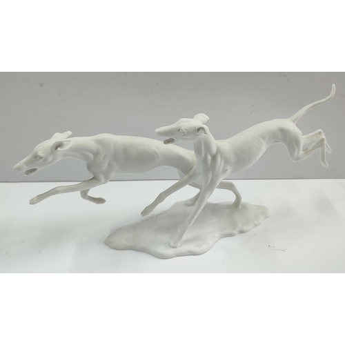 156 - Kaiser, Germany, signed G. Bochmann, porcelain whippets

35 x 12 cm