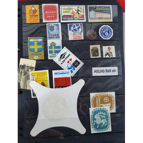 272 - Black folder containing a large quantity of Sweden stamps and stickers, all Swedish town or business... 