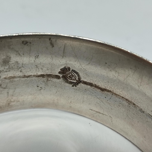 12 - An unusually marked ornate metal bangle, possibly Silver

70 grams