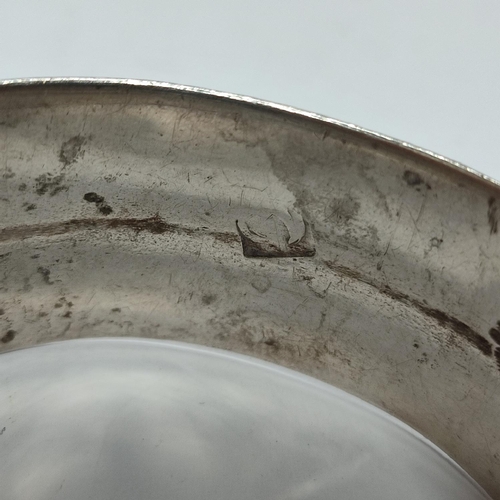 12 - An unusually marked ornate metal bangle, possibly Silver

70 grams