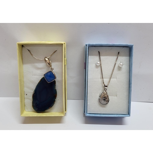 33 - Two silver necklaces one with large blue stone pendant, both in presentation boxes (2)