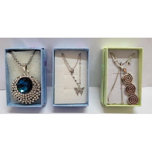 34 - Three silver necklaces all with various silver or stone pendants, all in presentation boxes (3)