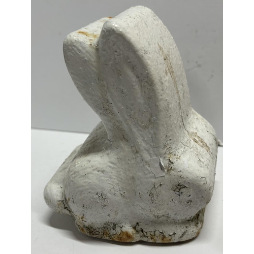 105 - Pair of heavy cast iron Rabbits door stops (2)