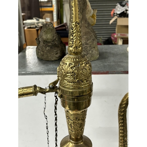 179 - Ornate brass genie bottle converted into a lamp with bulbs in the top and bottom

93cm Tall