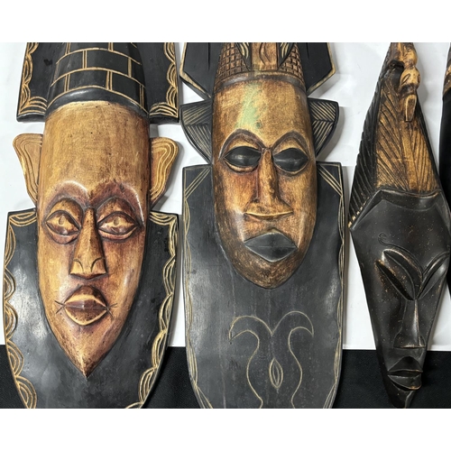 183 - Four African carved wood Masks (4)