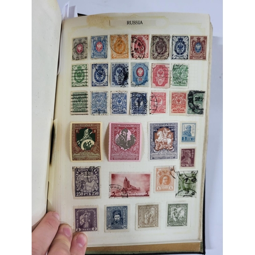 261 - Black stamp album containing British QV -QEII and world stamps, many 19thC examples together with ma... 