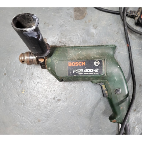 217 - Two Bosch drills, one electric, the other with 2 batteries and charger (2)