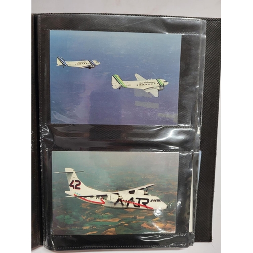 226 - Album containing 20thC colour postcards, mainly containing travel, air plane or car related examples... 