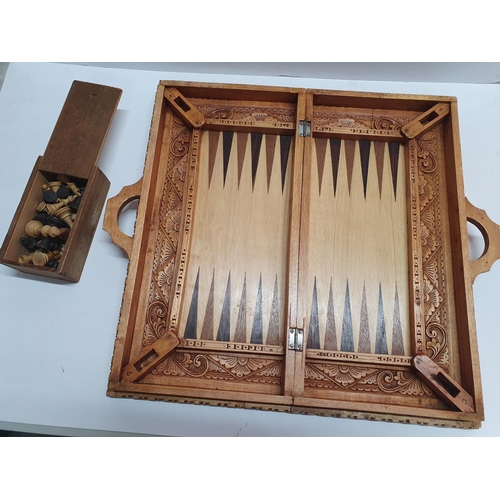 232 - Stunning carved wood chess board with backgammon board to other side together with a carved wood set... 