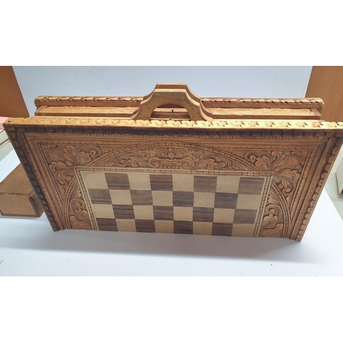 232 - Stunning carved wood chess board with backgammon board to other side together with a carved wood set... 