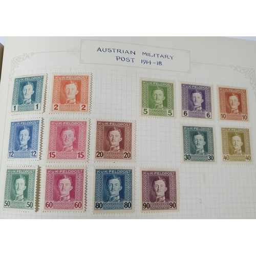 283 - Two old green stamp albums containing A and B countries, with good Austria including WWI postage set... 