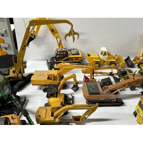 258 - Large Collection of diecast JCB Diggers and dump truck etc with other including Dinky, Matchbox, Cor... 