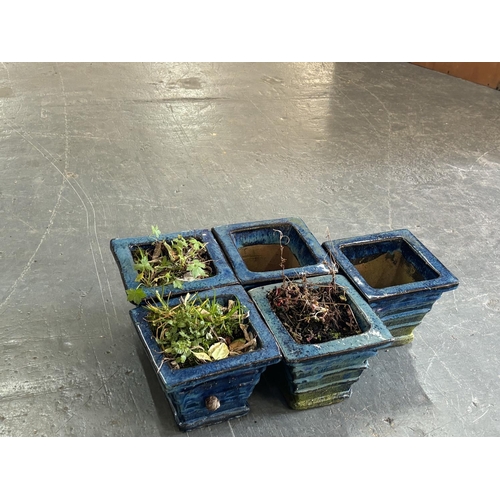 313 - Five small ceramic blue planters (5)