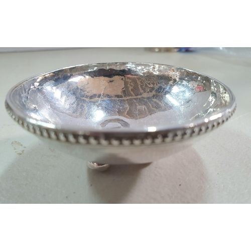 4 - Small silver bowl in plain form on 3 balled feet, marks rubbed away

45.5 grams