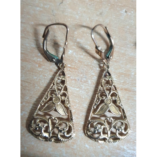 71 - Pair of 9ct gold ornate drop earrings (3.6 grams) together with some odd 9ct yellow gold earrings,

... 