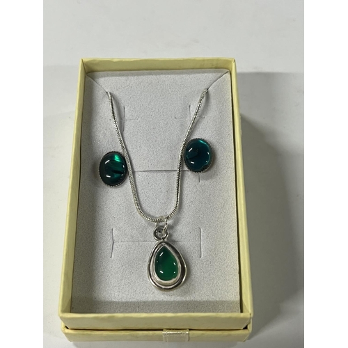 75 - Silver green stone pendant  with earrings along with 2 other silver necklaces