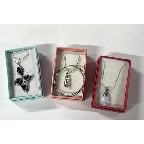 78 - Silver pendant on chain with hoop earrings along with 2 other pendants on chains (3)