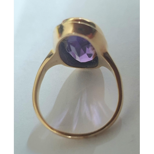 79 - 9ct yellow gold ring set with a large oval cut Amethyst,

4.9 grams gross              Size J