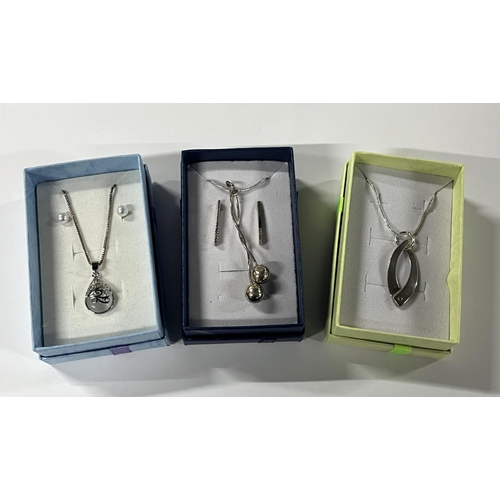 80 - Silver  cubic zirconia pendant on chain along with 2 other silver necklaces with earrings (3)