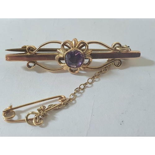 87 - Art Nouveau style 9ct yellow gold bar brooch inset with a central round cut Amethyst,

2.8 grams gro... 