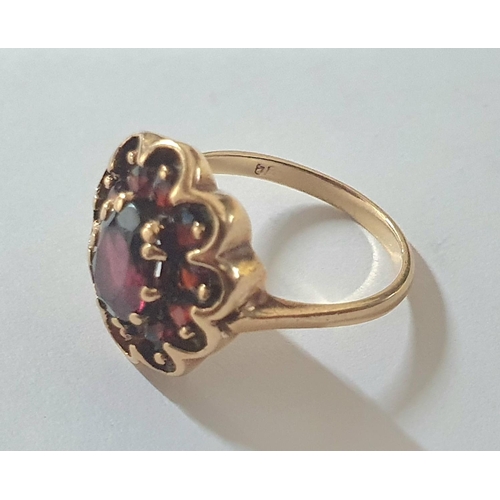 90 - 9ct yellow gold, Garnet cluster ring,

3.9 grams gross              size M