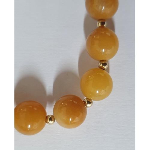 37 - Stunning golden amber Jade beaded necklace with 18ct gold clasp and 12 matching gold filler beads,

... 