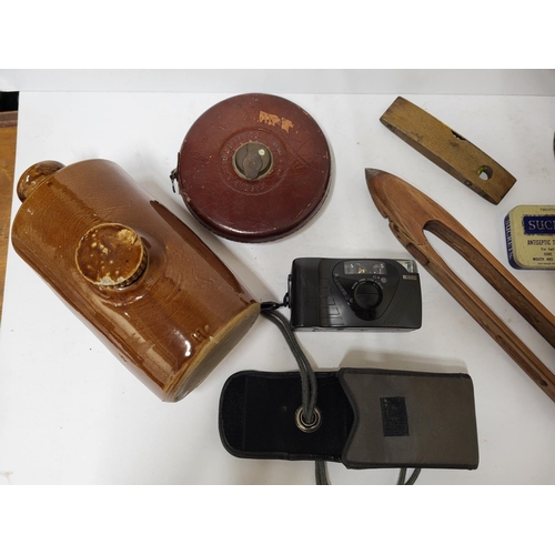 109 - Colelction of various items including a camera, vintage measuring tape and a ceramic hot water bottl... 