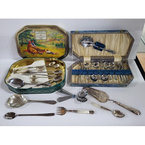 111 - Boxed Cutlery set as well as a tin of various peices of cutlery (Qty)