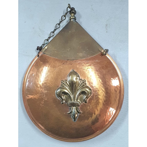 141 - Circular copper and brass powder flask with Fleur de Lis decoration