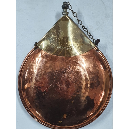 141 - Circular copper and brass powder flask with Fleur de Lis decoration