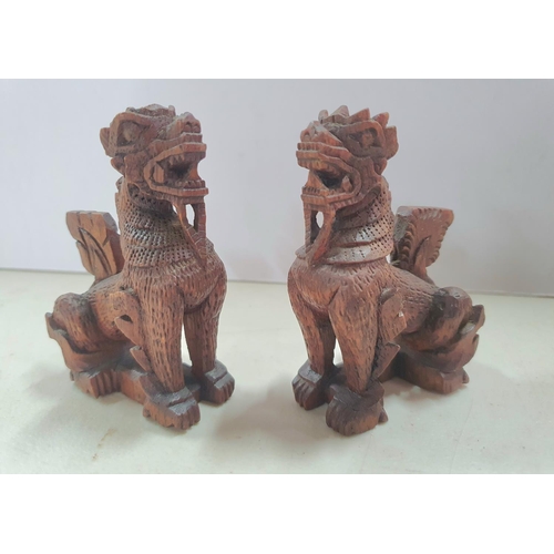 147 - Pair of hand carved small Chinese foo dogs (2),

Both measure 9cm tall x 6cm long