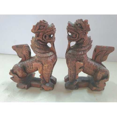 147 - Pair of hand carved small Chinese foo dogs (2),

Both measure 9cm tall x 6cm long