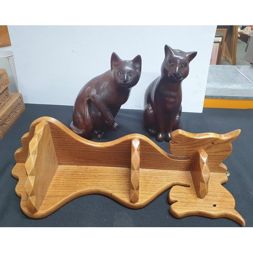 171 - Two large wooden Cat figurines with glass eyes together with a small Oak corner shelving with horses... 