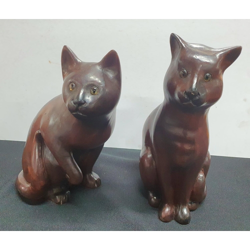 171 - Two large wooden Cat figurines with glass eyes together with a small Oak corner shelving with horses... 