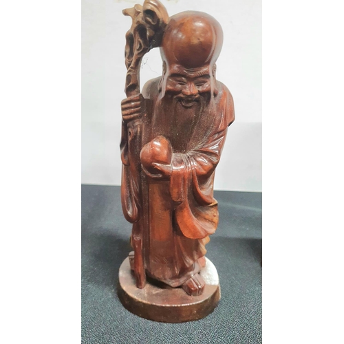 172 - Three carved Oriental hardwood figures (3)