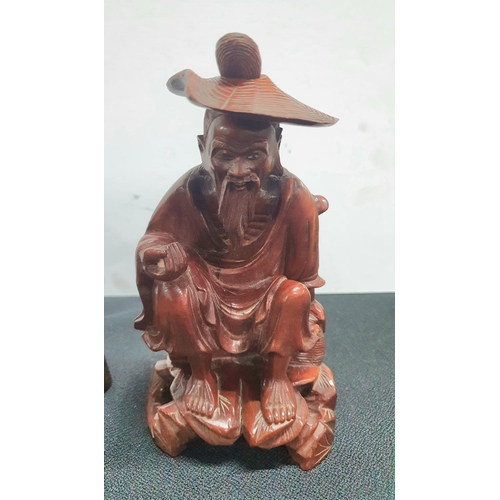 172 - Three carved Oriental hardwood figures (3)