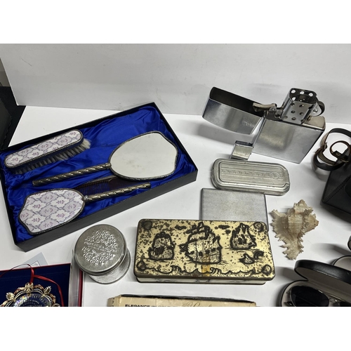 214 - Qty of items including vanity set, lighters, 2002 White House Christmas ornament, Ray Ban cases etc ... 