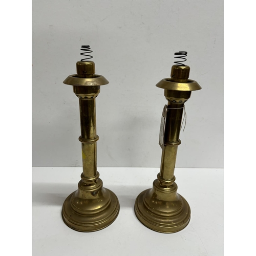 240 - Pair of heavy brass, sprung candlesticks