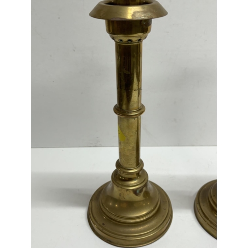 240 - Pair of heavy brass, sprung candlesticks