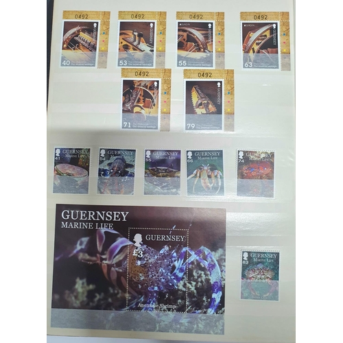 304 - Two stamp albums containing a large quantity of Guernsey MU from 1970s to 2015, approx 184 MU sets a... 