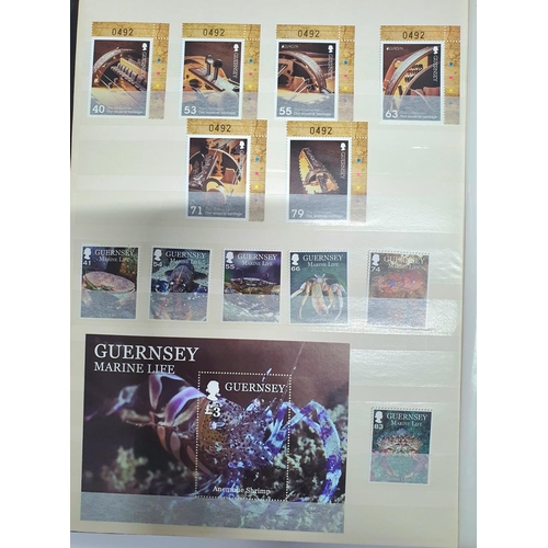 304 - Two stamp albums containing a large quantity of Guernsey MU from 1970s to 2015, approx 184 MU sets a... 