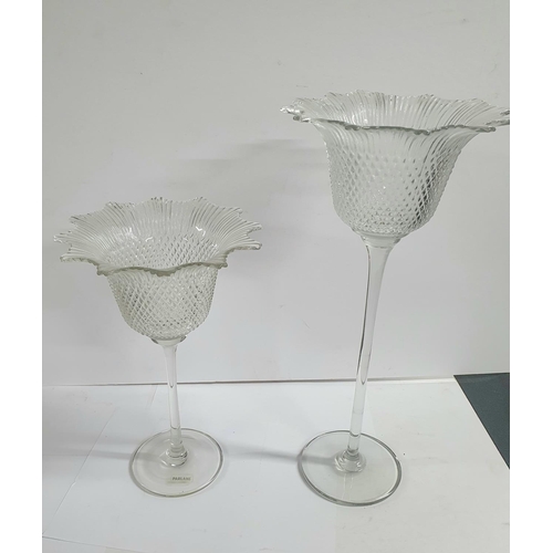 579 - Pair of fine quality free standing, tall glass candle holders by Parlane (2),

Tallest is 40cm tall