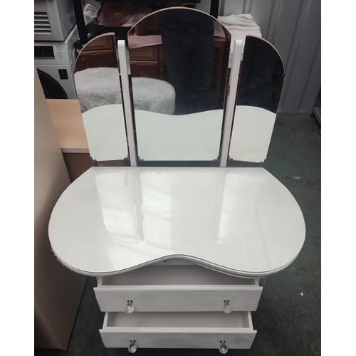 606 - A kidney shaped dressing table with tri-folding mirror and stool