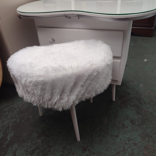 606 - A kidney shaped dressing table with tri-folding mirror and stool