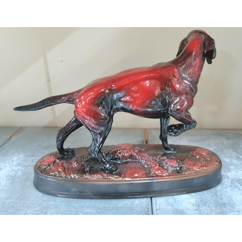 233 - Large porcelain Pointer dog in flambé red with 