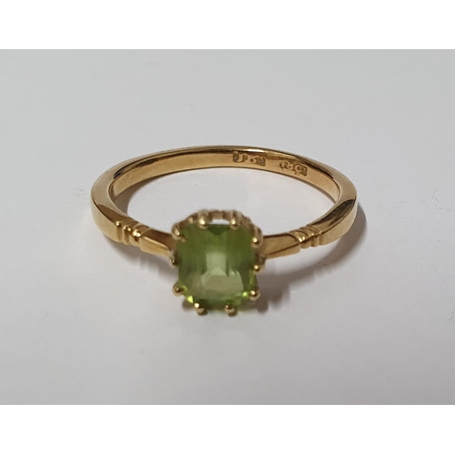 28 - 18ct stamped ring with solitaire green, Peridot type stone,

3.2 grams gross       size P